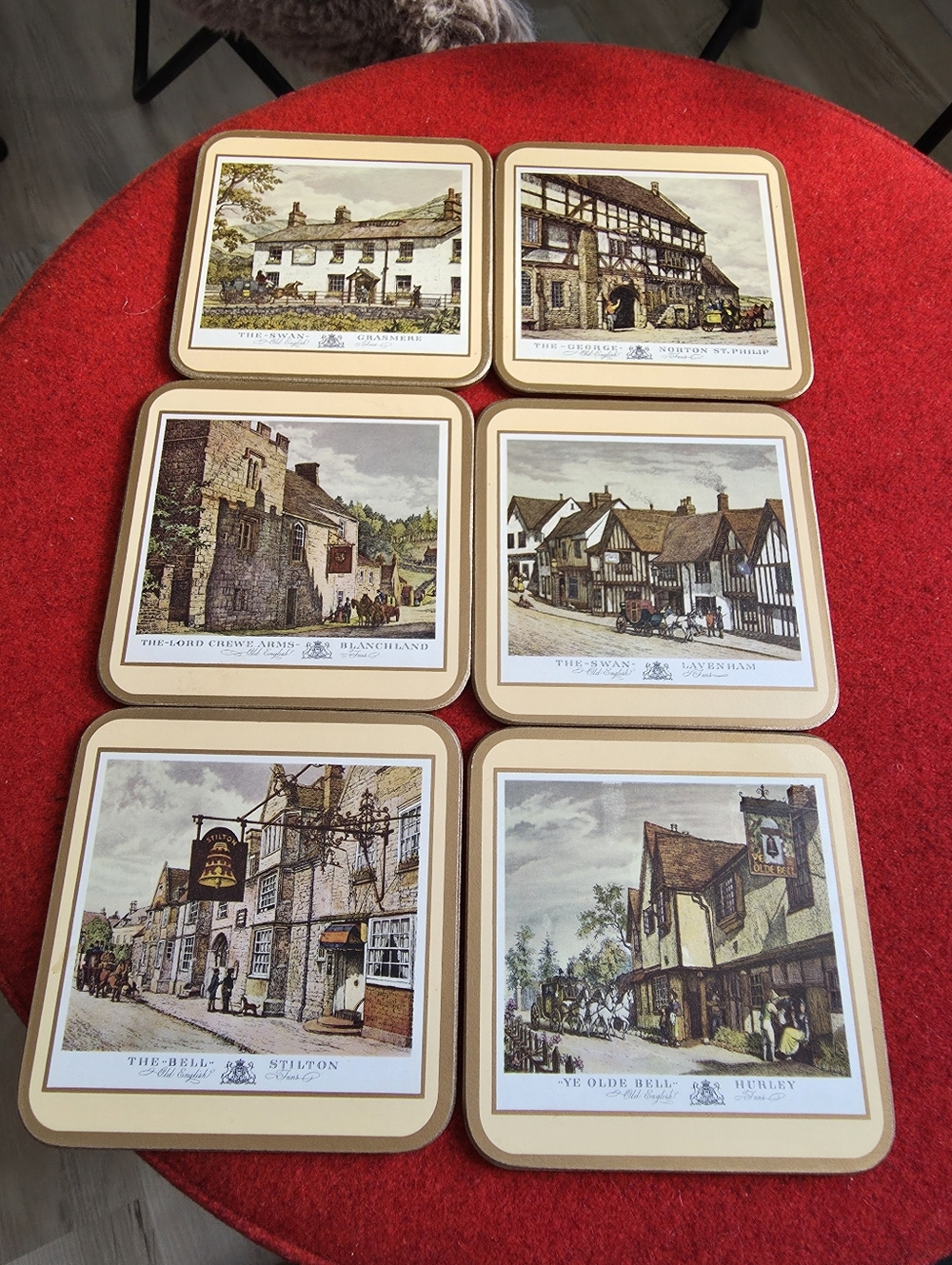 Vintage set of Pimpernel cork-backed coasters featuring scenes of English inns